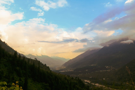 Landscape, Manali City during a sunset displays an exotic play of light, colors and clouds. The Vyas...