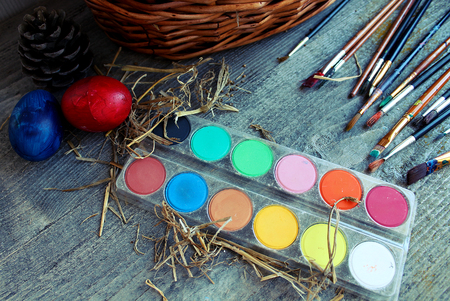 brushes and paints for coloring eggs for Easterの写真素材