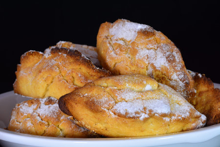 Delicious fresh baked pastries isolated on black background