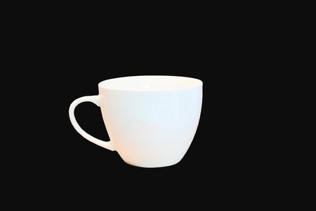 white coffee cup on a black background isolatedの写真素材