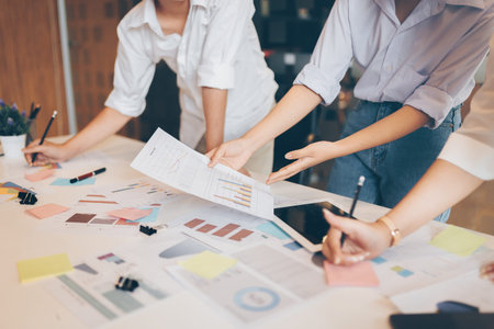 Business team working in office. The team meeting and working for project. And talking in group. On...