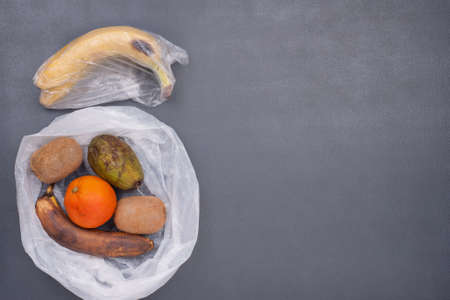 Picture of  rotten fruits and vegetable  in cellophane bags. Zero Waste Concept. Vegetables and fruits VS plastic bags, because they became unpreserved inside cellophane bags .の写真素材