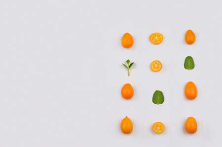 Fresh  organic kumquats pattern . Fruit with  sweet tart citrus refreshing flavour. Kumquat means âgolden orangeの写真素材