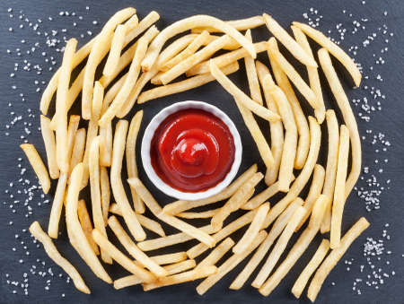 French-fried potatoes with sauce and sald on the slate board. Fries,chips,snack  or finger food are one of the most popular dishes.の写真素材