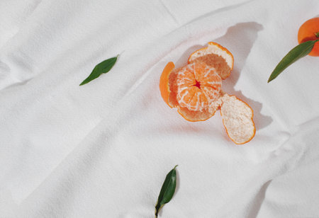 Creative background made with fresh tangerines on white  background. Minimal summer fruit flat lay.の写真素材