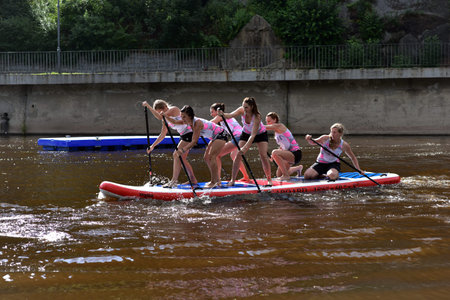 Girls racing team are paddling in Jizera River, Bohemian Paradise