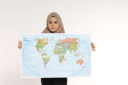 Portrait of Muslim Business woman executive reading map with face expression isolated white backgroundの写真素材