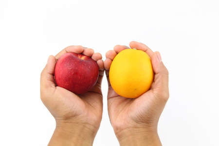 Hand holding Fresh healthy fruits apple with thumbs up sign isolated on white background. Copy Space concept. Healthy Foodの写真素材