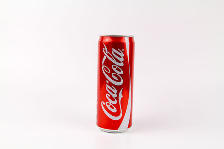 KUALA LUMPUR, MALAYSIA - 6th August 2017: A can of Coca Cola soft drinks over wooden background....