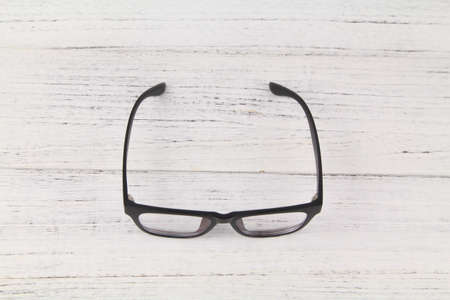 Black Eye Glasses Isolated Over Wooden Backgroundの写真素材