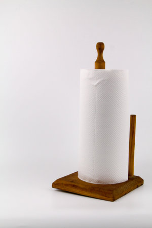 White paper towel rolls on stand holder isolated white backgroundの写真素材