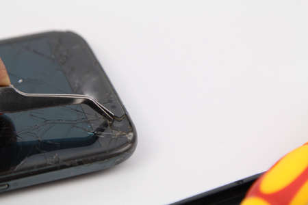 Cell phone repair. Smartphone parts and tools for recovery, selective focus.の写真素材
