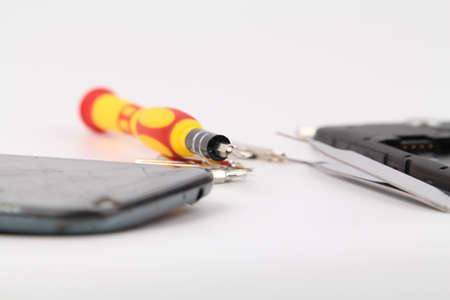 Cell phone repair. Smartphone parts and tools for recovery, selective focus.の写真素材
