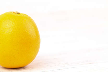 Fresh orange over white wooden background. Copy Space Conceptの写真素材