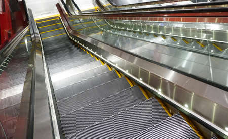 Electric Escalator in metro. Moving down staircaseの写真素材