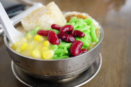 Cendol Desert. Asian favourite iced dessert of rice flour and pandanus jelly with coconut milk and palm sugarの写真素材
