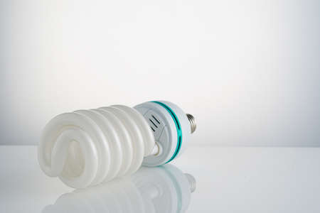 Energy-saving Helix shape light bulbs isolated white background. Light luminescence fluorescent lamp.の写真素材