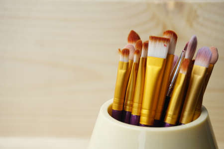 Make up brushes in wooden box. Copy Space Conceptの写真素材