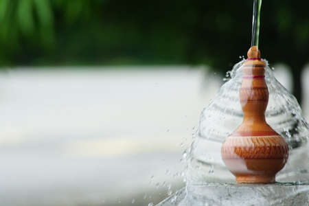 Water pour on the Traditional Malay hand made Clay pottery arts for water storage container or Labu Sayong or Labu Sayungの写真素材