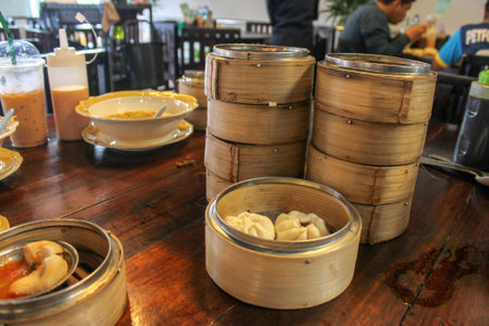Southern Thai style breakfast and brunch. Dim sum is a style of Chinese cuisine prepared as small bite-sized portions of food served in small steamer baskets. A Hatyai Bangkok Thailand Street Food.Selective Focus.の写真素材