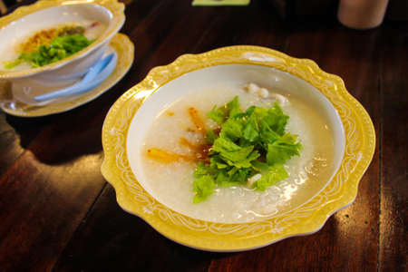Traditional chinese congee or porridge rice gruel in bowl. Thailand Hatyai Street Food.の写真素材