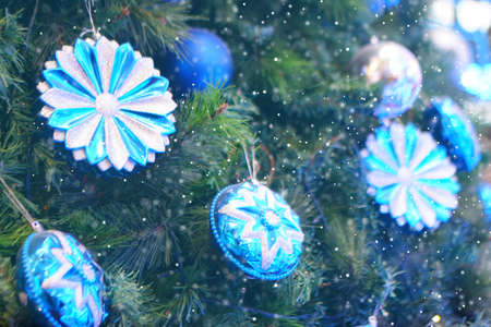 Close up Christmas tree decorated with silver and blue Christmas balls. Snow Effect Soft Focus. Copy Space Conceptの写真素材