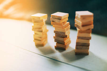 Wooden Cubes stack each other on Wood. Finance Business Design Templateの写真素材