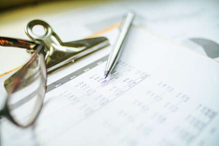 Close up a calculator over yellow background. Financial Calculation Concept.の写真素材