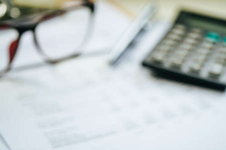 Close up a calculator over yellow background. Financial Calculation Concept.の写真素材