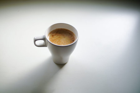 Close up cofee latte on white mug cup.の写真素材