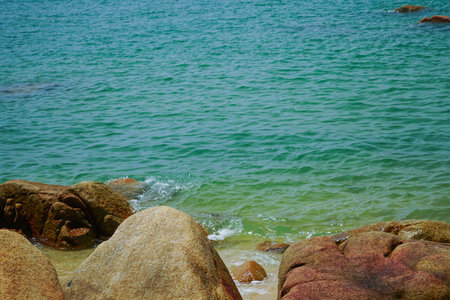 Tropical beach and blue sky background ona Rocky beach landscape on summer day, Beautiful turquoise...