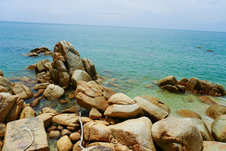 Tropical beach and blue sky background ona Rocky beach landscape on summer day, Beautiful turquoise...