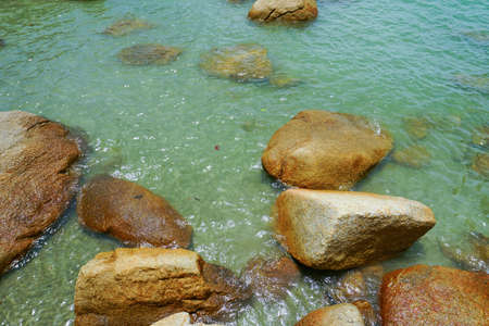 Tropical beach and blue sky background ona Rocky beach landscape on summer day, Beautiful turquoise color sea water , Travel holidayの写真素材