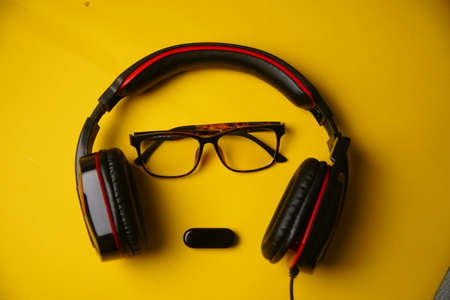 Black Gaming headphones on yellow background. Music concept.の写真素材