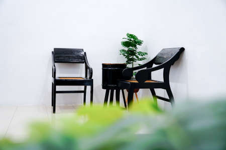 Stylish interior design of living room with wooden retro commode chair setの写真素材