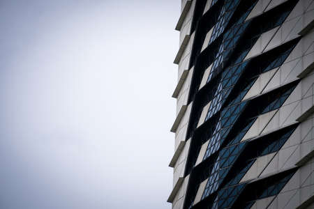 Bottom view of modern skyscrapers in business district. Looking up at business buildings in downtown.の写真素材