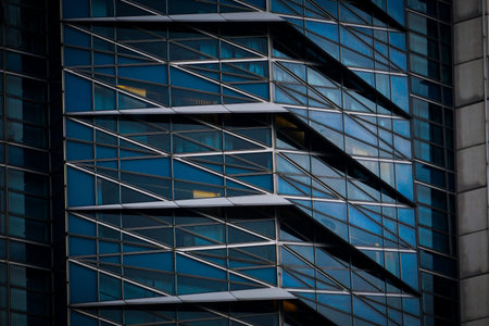Bottom view of modern skyscrapers in business district. Looking up at business buildings in...