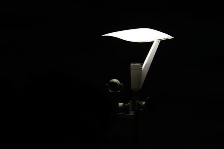 Light Pole with Security Camera equipment over black background. Isolatedの写真素材