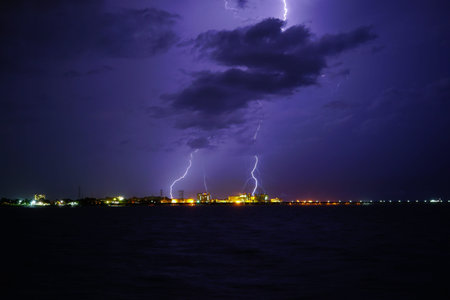 Thunderstorm with lightning in the port city by the sea