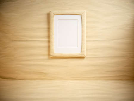 Paper room with blank frame on the wall の写真素材