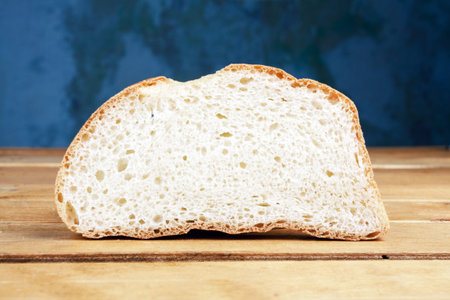 Slice of bread on old wooden table