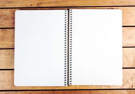 Opened blank notepad on old wooden table
