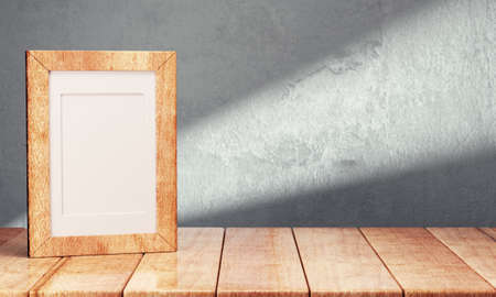 Blank frame on wooden table over gray background. 3d renderingの写真素材
