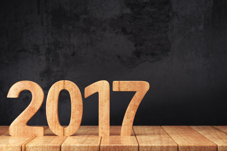 2017 New year digits on wooden table on dark grunge background. 3d render