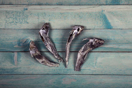 Dry goby fishes on old wooden tableの写真素材