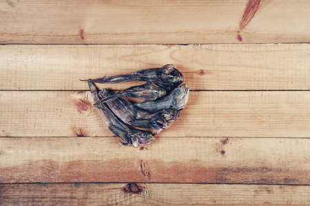 Dry goby fishes on old wooden tableの写真素材