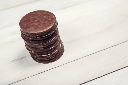 Cookies with chocolate glaze on white wooden backgroundの写真素材