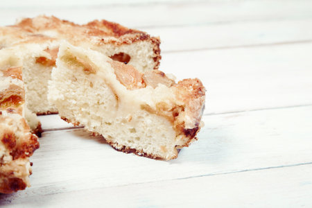 Homemade apricot cake on white wooden background, closeupの写真素材