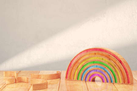 Cartoon styled rainbow on wooden table over bright background. 3d renderingの写真素材