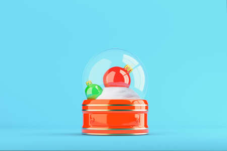 Snow globe with christmas balls on bright blue background. 3d renderingの写真素材